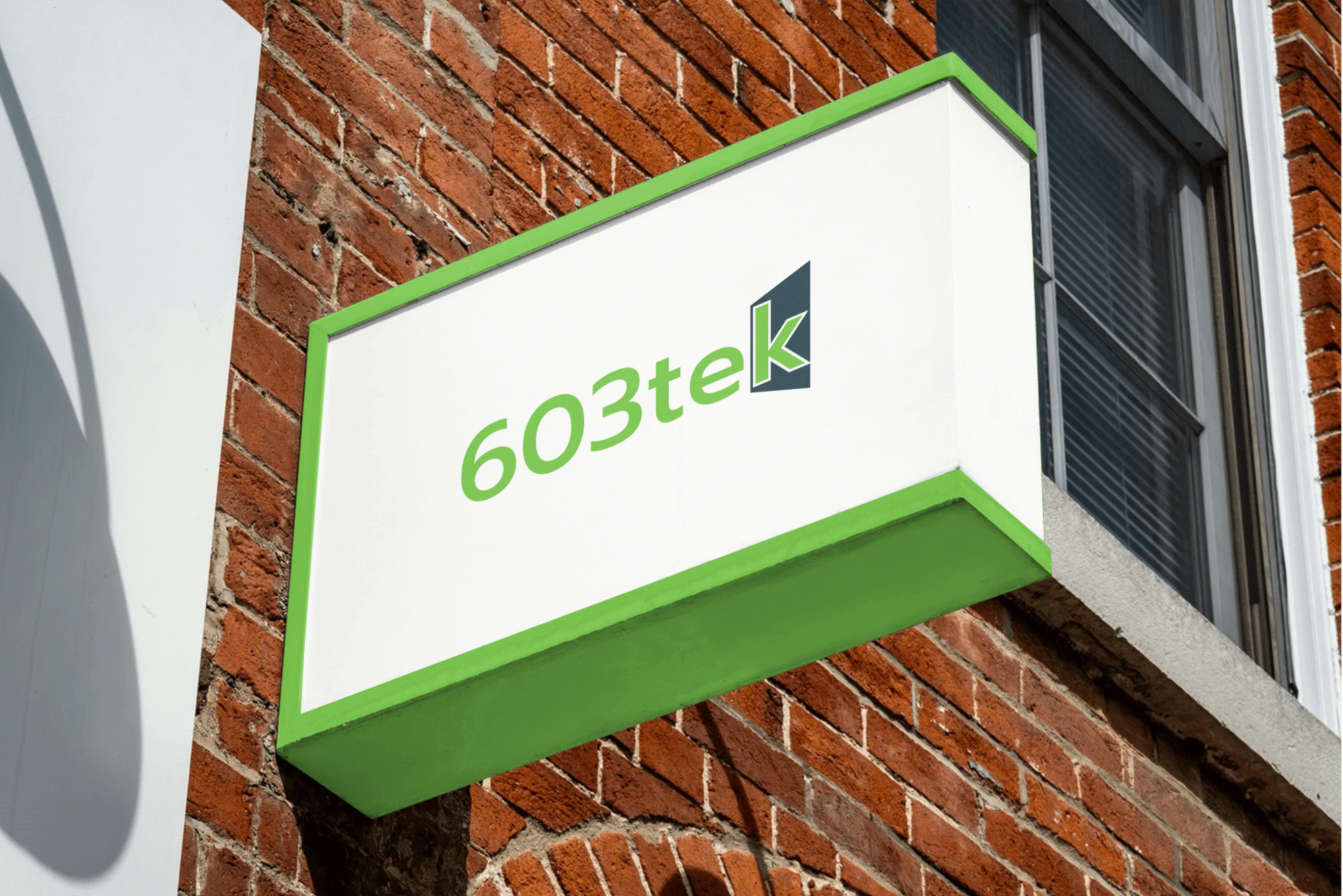 Outdoor sign displaying the 603tek logo, a local IT services company in Northern New Hampshire
